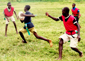 CATCH ME IF YOU CAN: Boys under the age of 14 enjoying tag rugby in Rubavu, Northern Province (Courtesy photo)