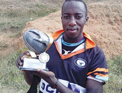 Buffaloes' Lucien Bikamba shows off the Kigali 7s trophy his club won yesterday (Courtesy photo)