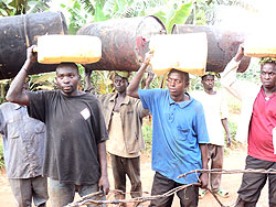  Kanyanga distillers walking to a Police station. The New Times /S. Rwembeho.