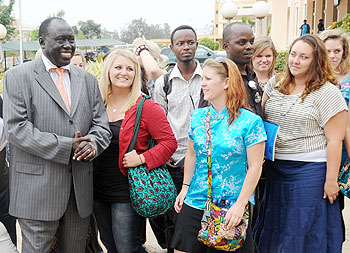 Justice Minister Tharcise Karugarama (L) with the students from Global Youth Connect on Friday. The New Times /John Mbanda.