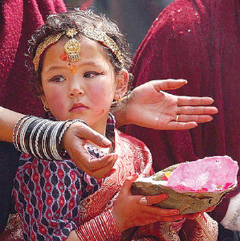 A young girl in Nepal participates in a symbolic marriage to Lord Vishnu, during the ritual ceremony of Lhi. (Photo-JMHullot)