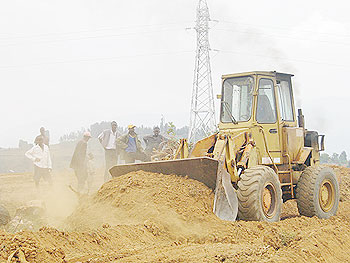  A bull dozer levels the land where a health centre is to be constructed in Kibilizi Sector, Nyamagabe District. The New Times /Grace Mugoya