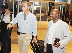 Rodrigo Arboleda (L) on arrival at Kigali International Airport welcomed by Nkubito Bakuramutsa. The New Times /T.Kisambira.