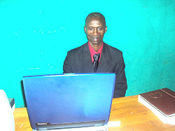 Peter Niyonsenga doing his work on computer / NewTimesPhoto S.Rwembeho