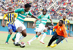 LEFT FOR DEAD: Amavubiu2019s keeper Jean Luc Ndayishimiye closes in to block an attempt on goal by Cote du2019Ivoireu2019s two-goal hero Wilfried Boni during yesterdayu2019s game. Cote du2019Ivoire won the contest 5-0 at Amahoro stadium. The New Times / Timothy Kisambira.