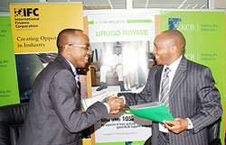 L-R; Kariuki Thande, Senior investment officer with IFC, KCB Rwanda Managing Director Maurice Toroitich and Chief Business officer with KCB James Agin during the signing of a loan agreement worth US$5m in Kigali yesterday