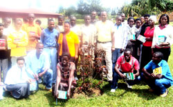 Leaders of Cooperatives pose for a photo with their trainers. The Sunday Times / Stephen Rwembeho.