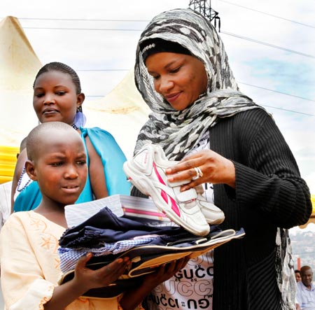  Honourable Saidat Mukanoheri handing out scholastic materials  The Sunday Times / Timothy Kisambira