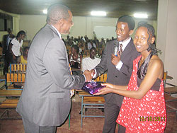  Rwanda's High Commissioner to Uganda Frank Mugambage (L) receives a gift from the student leaders yesterday. The Sunday Times /Gashegu Muramira