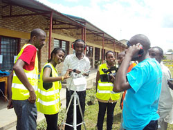 ICK students test an atmospheric sound equipment during the display of equipment used in environmental studies. Photo The New Times / Daniel Sabiiti