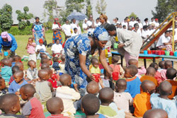 Nursery school children being given poridge. The government wants all children in primary school given lunch. The New Times / file.