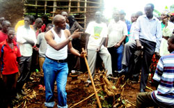 Chairman of Unity and Reconciliation committee, Rwamagana District, Emmanuel Rukera, talking to Fumbwe residents. The Sunday Times / Stephen Rwembeho.