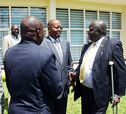 Local Government Minister James Musoni (C) with the Chairperson of Kitgum District, Nyeko and another delegate in the foreground. The Sunday Times/ Timothy Kisambira