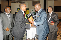  (L-R) BNR Governor, Claver Gatete, Finance Minister John Rwangombwa, Apostle Paul Gitwaza of Zion Temple and CFF Chairman Daniel Mugisha, after the Prayer Dinner on Friday. The New Times / J. Mbanda.