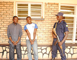 The men who are suspected of having robbed the Pastor, under guard. 