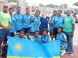 IRB Womenu2019s development officer, Susan Carty (Back row, 4th right) poses for a group photo with Rwanda's youthful women's team in Botswana last year. The New Times. Courtesy photo