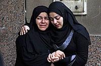 Egyptian women react after hearing about the death of their relatives during clashes at a soccer stadium, outside a morgue in Cairo, Egypt, Thursday, Feb. 2, 2012. Net photo.