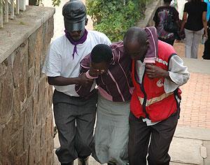 Volunteers carry a way a traumatised patient during the genocide mourning period last year. Ministry of Health and CNLG have differed over handling of  trauma cases
