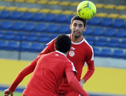 Tunisian skipper Issam Jemaa (Top) heads the ball during a training session in Bongoville on Friday. Net photo