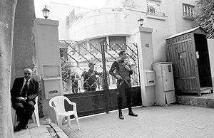 Egyptian soldiers stand guard in front of the US National Democratic Institute, an NGO rights group in downtown Cairo in December 2011. Net photo