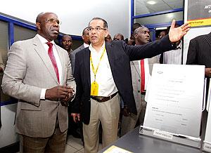 CEO of MTN Rwanda Mr Khaled Mikkawi  (R)  with Prime Minister Pierre Damien Habumuremyi during the latter's tour.  The New Times / T.  Kisambira.