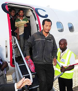 Released Chinese hostages who were abducted in Sudan arrive at Wilson Airport, in Nairobi, Kenya, Feb. 7, 2012. Net  Photo.