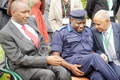 IGP Emmanuel Gasana (C) listens to Lt. Gen. Hamid Mannan from Sudan Police as Francis Rwego  from Uganda looks on. The New Times /J/.banda.