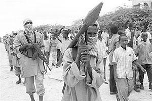 A member of the hardline Al Shabaab Islamist rebel group carries a rocket propelled grenade (RPG) during a demonstration in Mogadishu, October 30, 2009.