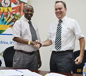 Emmanuel Safari (left), the executive secretary of CLADHO and TradeMark East Africa country director, Mark Priestley at the signing of the MoU between the two bodies in Kigali.
