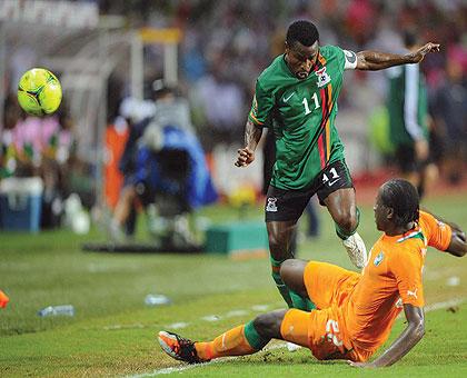 Zambia captain and player of the tournament, Christopher Katongo, vies for the ball with Ivorian defender Sol Bamba, during last night's final. Net photo.