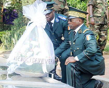 Ivorian army chief Lt. Gen. Soumau00efla Bakayoko (right) pays tribute to the 1994 Genocide victims at Kigali Genocide Memorial yesterday. The New Times /J. Mbanda.