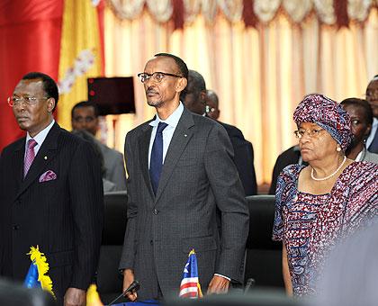 President Paul Kagame with Chadian President Idriss Deby (L) and President Ellen Johnson Sirleaf of Liberia (R) during the AU Summit in Cotonou yesterday. The Sunday Times / Village Urugwiro.