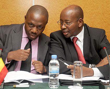 Local Government ministers Adolf Mwesigye of Uganda and  James Musoni of Rwanda at the JPC meeting in Kigali on Monday. The New Times / John Mbanda.