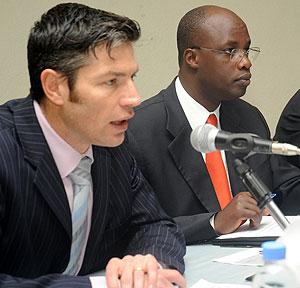 Pierre Souverain from Pfizer (L) with  acting Director General of RBC Claver Kayumba during the dialogue. The New Times / John Mbanda.