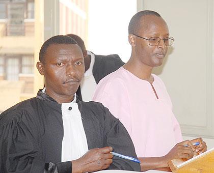 Deo Mushayidi with his lawyer during an earlier appearance before the High Court.  The New times / File.