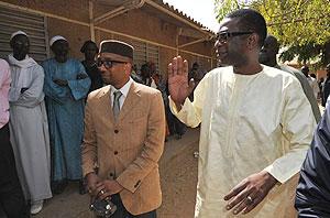 Sengalese singer and opposition political activist Youssou Nu2019Dour arrives to cast his vote on February 26 at a polling station in Dakar. Net photo.