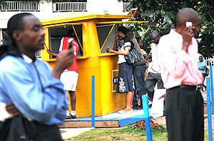 MTN subscribers at a vending point in Kigali. Con artists have resorted to swapping people's Sim Cards before defrauding them. The New Times / John Mbanda.