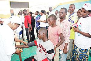 People queue for heart check-up. Rwandans have been called upon to conduct regular body check-ups The New Times / File.