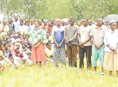 The suspected murderers paraded in Kaduha village-Munyaga sector as stunned residents look on. The New Times / S. Rwembeho.