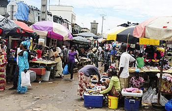 Shoppers buy products at a market in Conakry, Guinea in 2010. Fifty people travelling to a weekly market were on Saturday killed and 27 injured when the lorry they were travelling in crashed