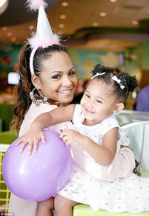 Violet and her violet balloon. Christina Milian played around with her two-year-old daughter on Saturday.