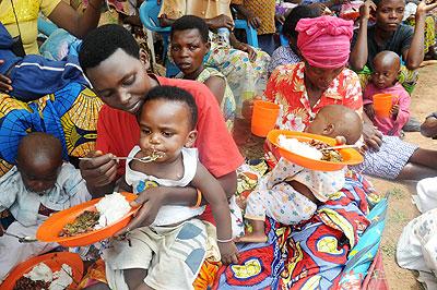 Mothers in Butamwa Sector, Nyarugenge District, feed their babies on a balanced diet during the Women's Day celebrations yesterday. The New Times / John Mbanda.