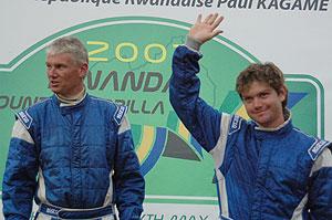 Zimbabwe's Conrad Rautenbach (R) waves to the crowd after winning the 2007 Rwanda Mountain Gorilla rally. The New Time / File.