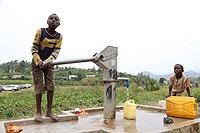 Children drawing water from a borehole. Three districts in Southern Province will soon benefit from a key water project. The New Times / File.