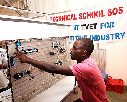 An electronics student makes a demonstration during a past TVET expo. Many secondary schools will be phased out to pave way for more vocational, technical and professional courses. The New Times / File.