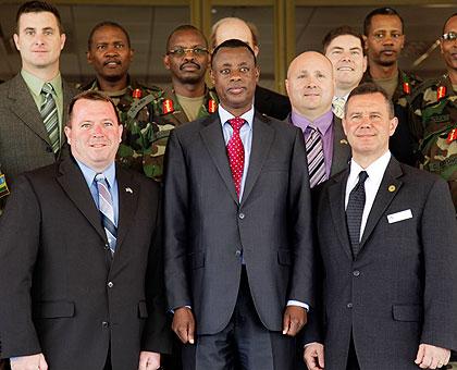 Gen. James Kabarebe (C) with the visiting senior officers from the United States Air War College. The New Times / Timothy Kisambira.