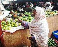 A fruit vendor in a Kigali market. The New Times / File.