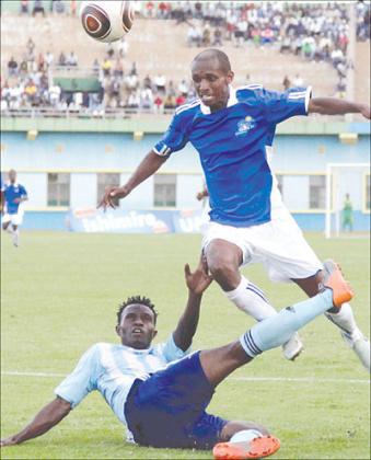 Rayon Sportsu2019 in-form Djamal Mwiseneza (R) and Police's Peter Kagabo during last week's league match. Mwiseneza is suspended for today's game against Marines. The New Times / File.