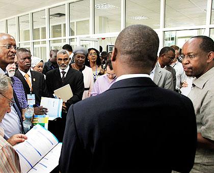 RDB's John Gara (R) addressing the visiting Members of Parliament yesterday. The New Times / Timothy Kisambira.