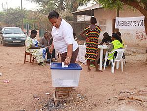 A voter casts her ballot in Bissau, Guinea-Bissau, March 18, 2012. Guinea-Bissauu2019s presidential election kicked off around the country Sunday morning. Xinhua